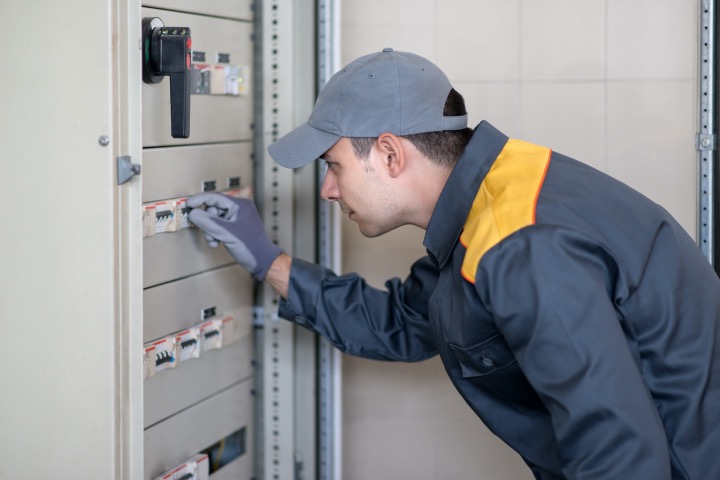 An electrical guy inspecting safety switch