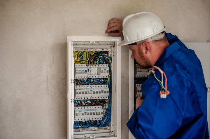 electrician working with electric board
