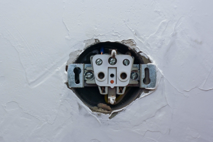 Picture of an outlet with cover plate removed